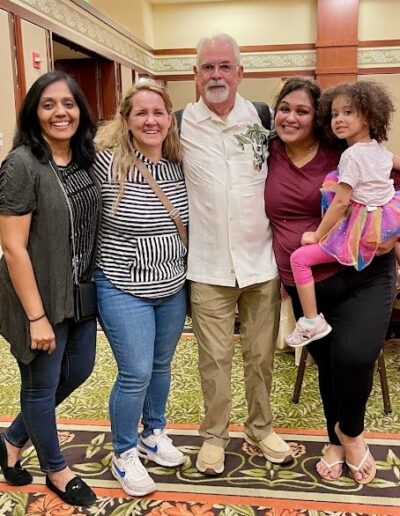 Dan, Nicole, Shaila, Disha, and Nicole's Daughter Posing for a Group Photo